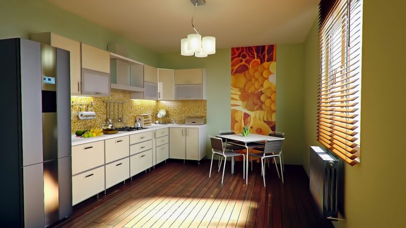 cucina con pareti verdi e mobili bianchi
